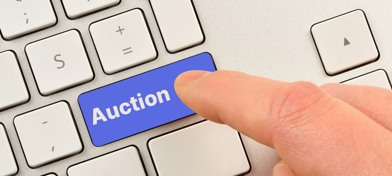 Finger pressing auction keyboard key